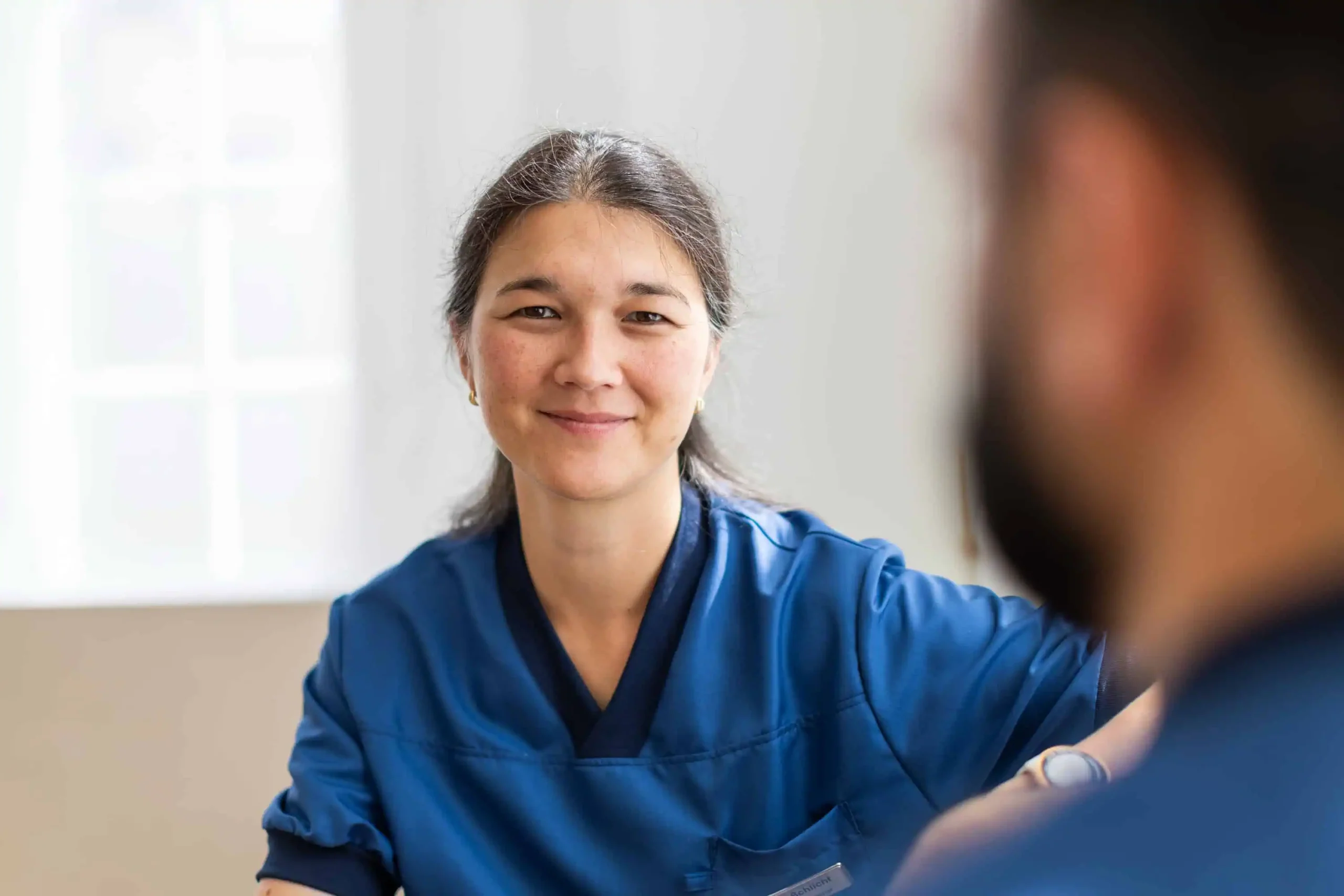 Optometrist smiles at the eye doctor in Copenhagen